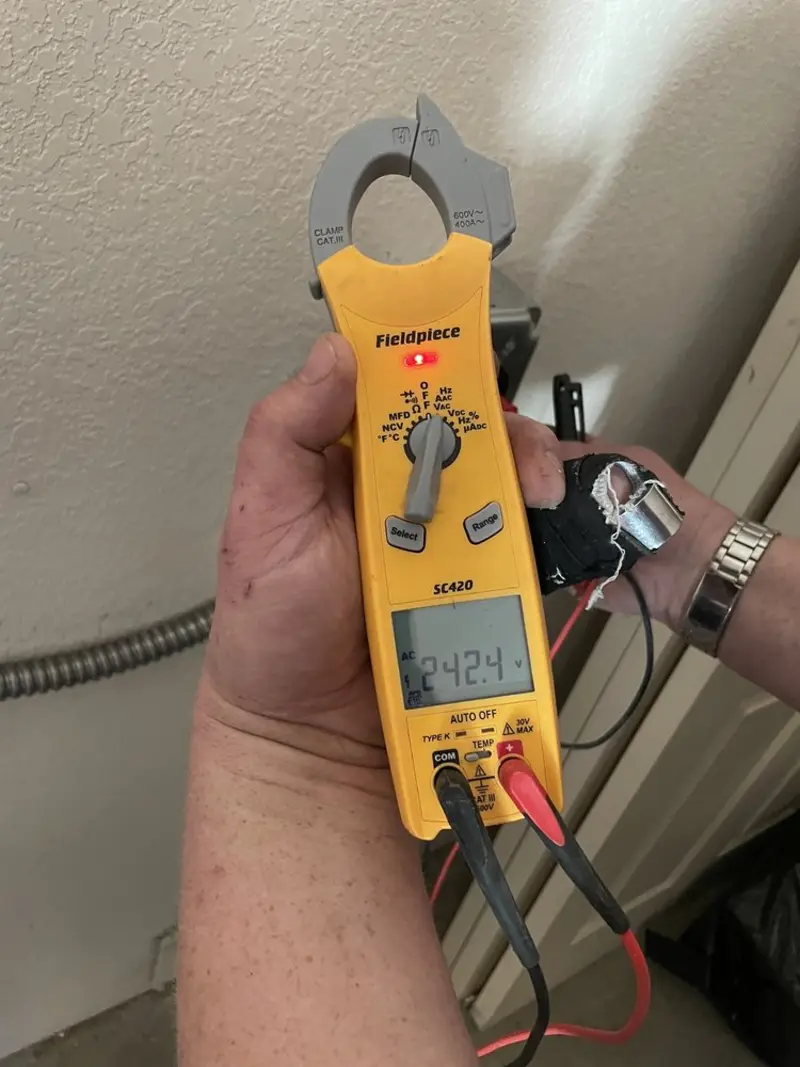 Voltage testing with clamp meter during Generator Installation in Lake Tapps